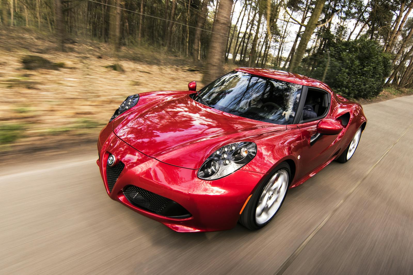 Red Alfa Romeo C4 on Road Near Trees, auto insurance